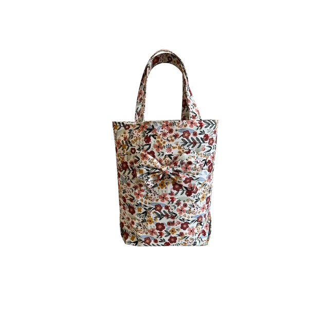 Bright Floral Bag With Attached A Bow
