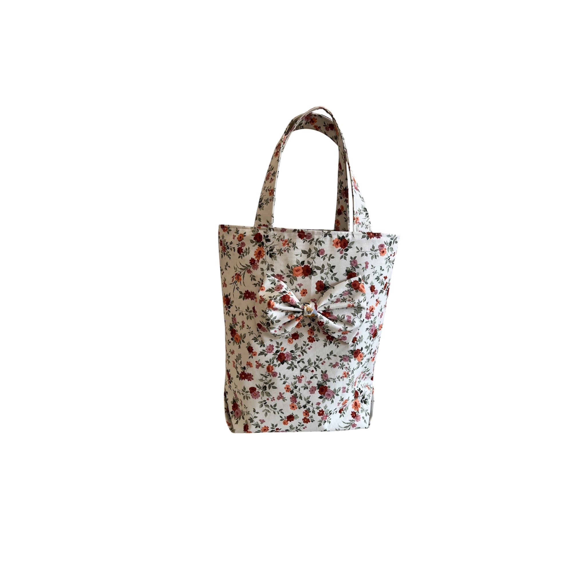Bright Floral Bag With Attached A Bow